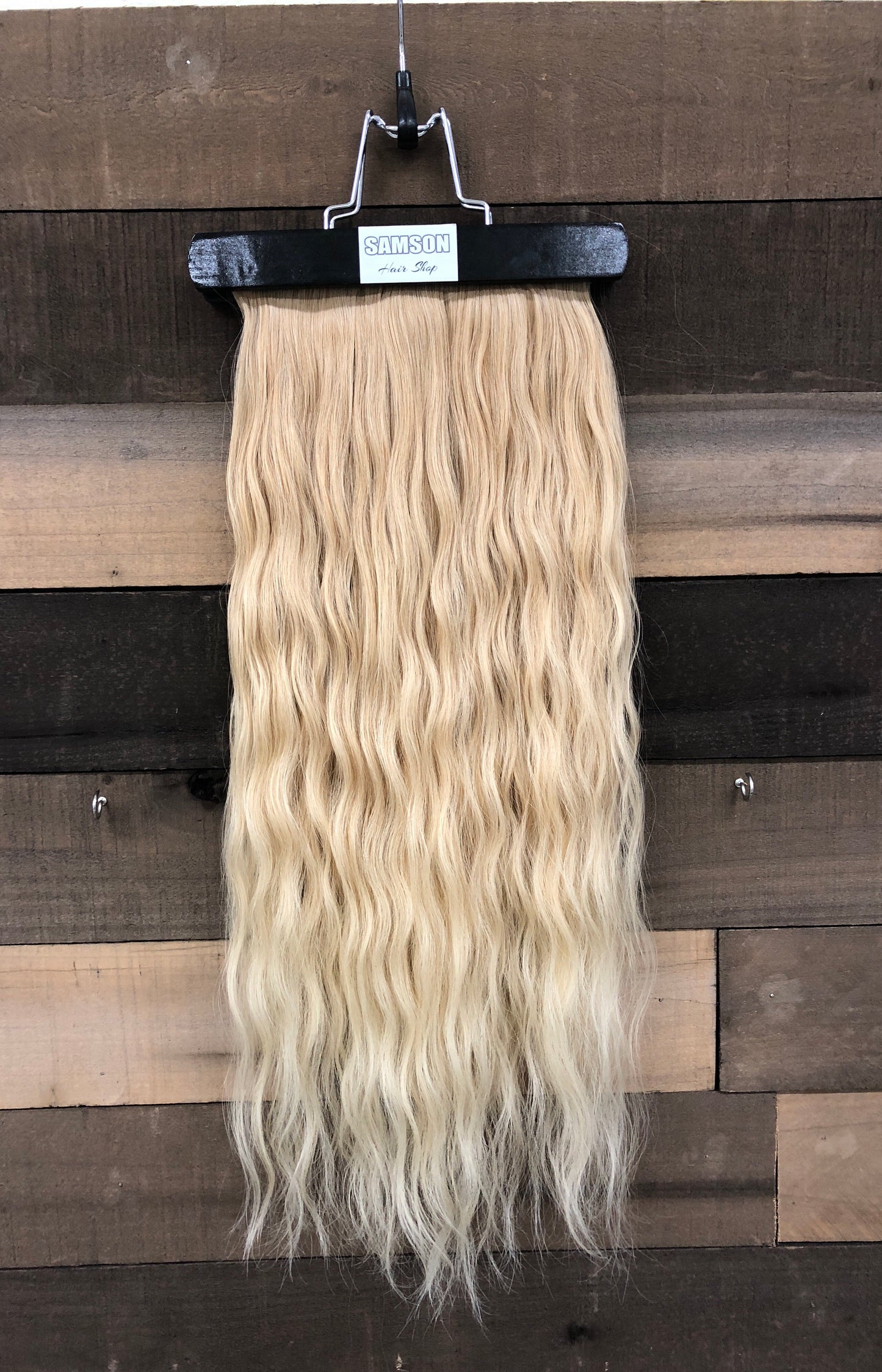 Storage hanger with pouch